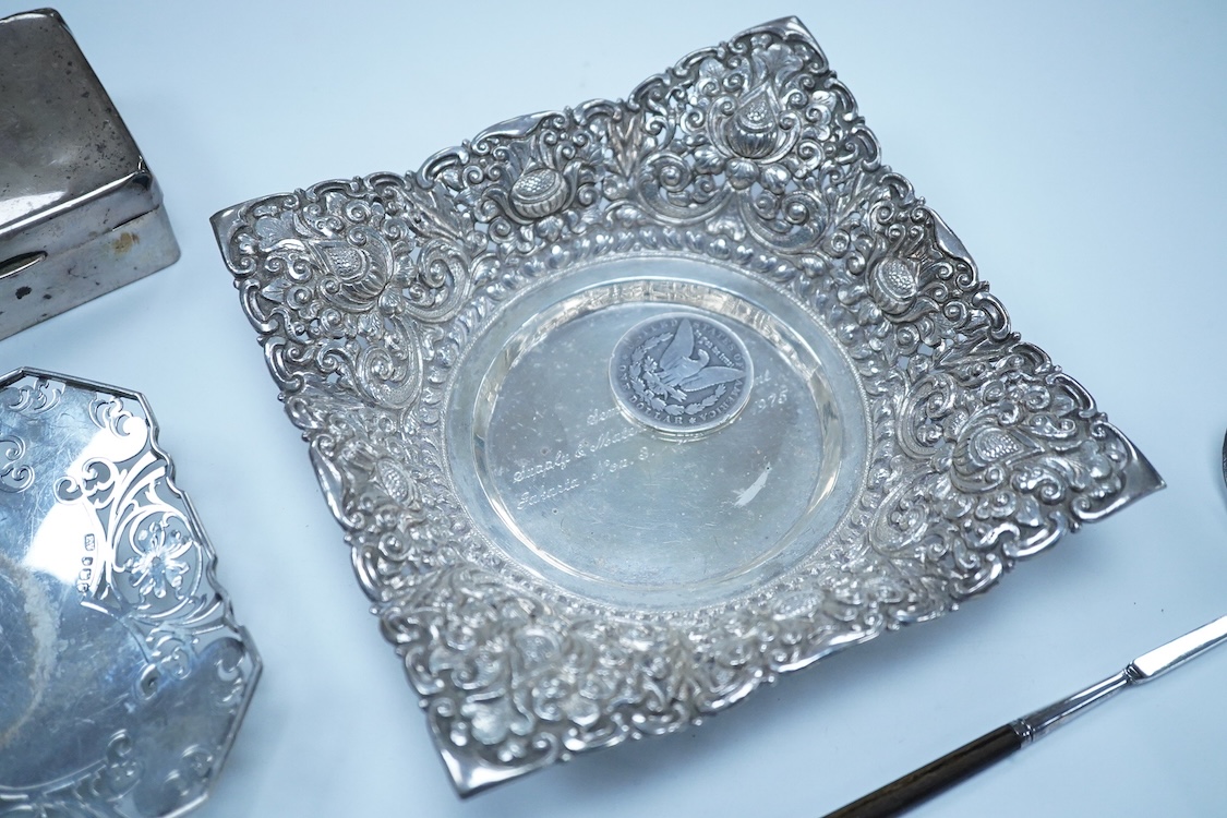 A small group of silver to include an Elizabeth II pierced shallow dish by Viners Ltd, Sheffield, 1957, diameter 12.4cm, a 1930's silver mounted cigarette box, a George III silver fiddle pattern sauce ladle and five silv
